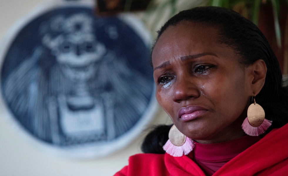 Mery Cortez, mother of Romario Veloz, the young Ecuadorian murdered in La Serena during the social protests that shook Chile since October 2019, cries during an interview with Efe, today in Santiago, Chile 13 October 2020. The slowness in the investigation of the murder of the young Romario Veloz, allegedly at the hands of a soldier during a protest in Chile in October 2019, led his mother, Mery Cortez, to do a 'performance' and undress in front of the Government headquarters to demand "justice". EFE/Alberto Valdes